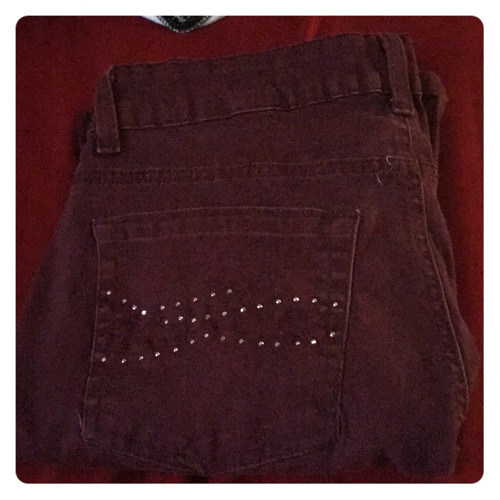 A pair of burgundy jeans size 12